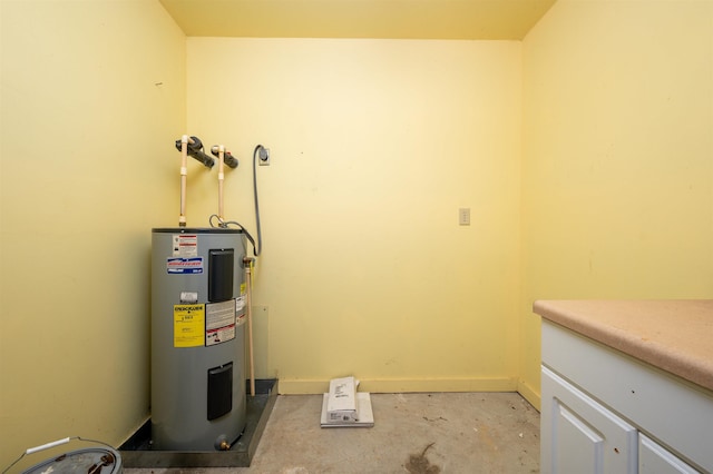 utility room featuring water heater