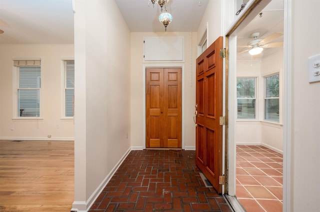 interior space with ceiling fan