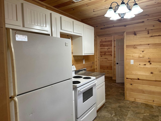 kitchen featuring pendant lighting, wood ceiling, white appliances, white cabinets, and wood walls