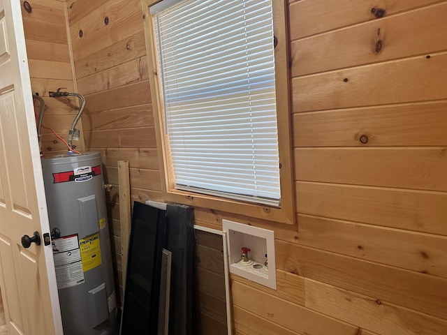 utility room featuring water heater