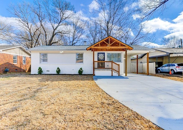 view of front of property with a carport