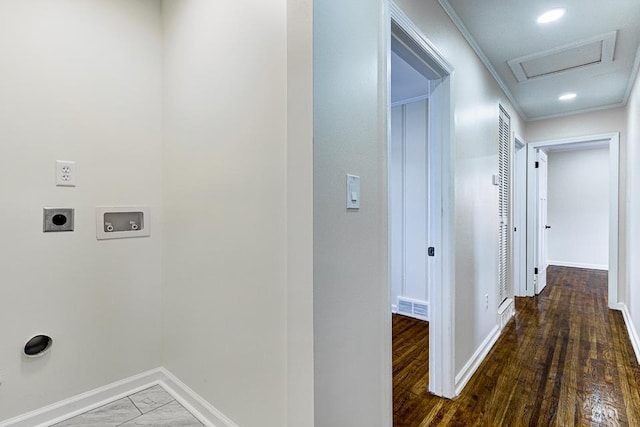 clothes washing area with hookup for a washing machine, electric dryer hookup, and dark wood-type flooring