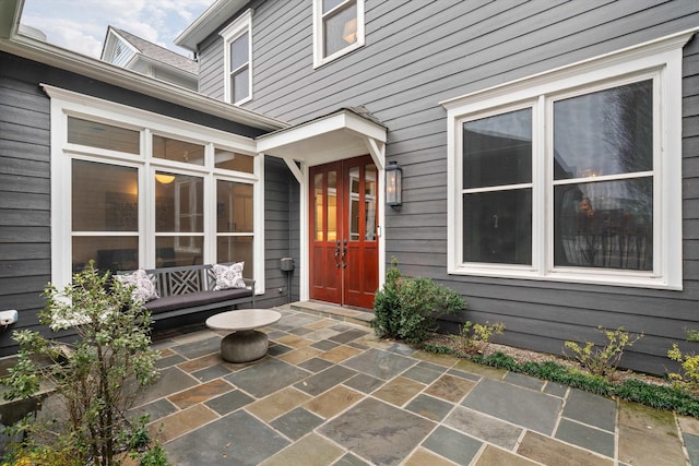 doorway to property with a patio area