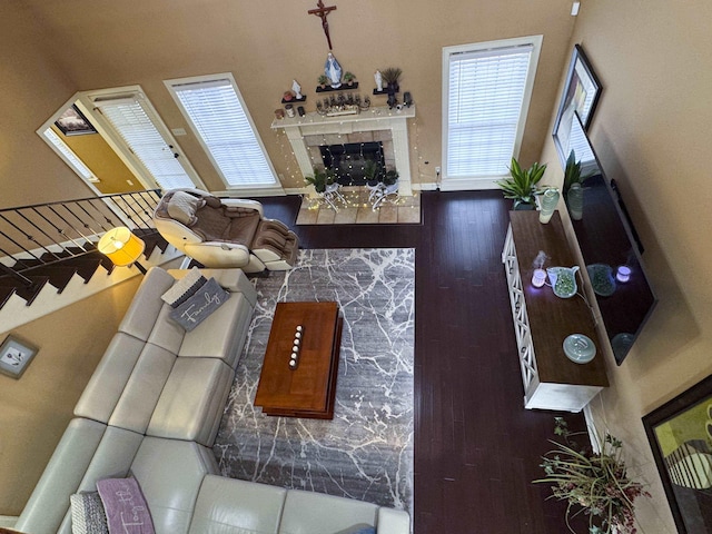 living room with a tiled fireplace