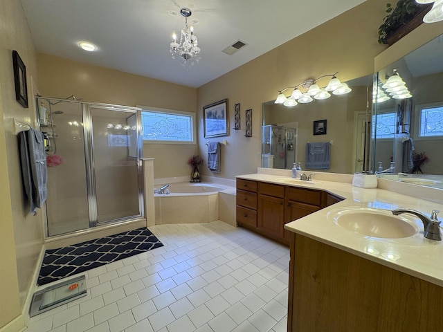 bathroom featuring a notable chandelier, plus walk in shower, vanity, and tile patterned floors