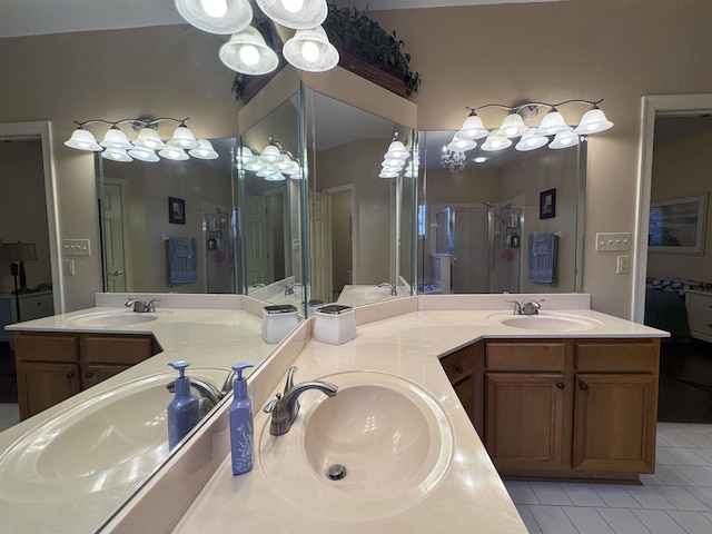 bathroom featuring vanity, tile patterned floors, and walk in shower