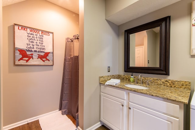 bathroom with vanity, hardwood / wood-style floors, and a shower with curtain