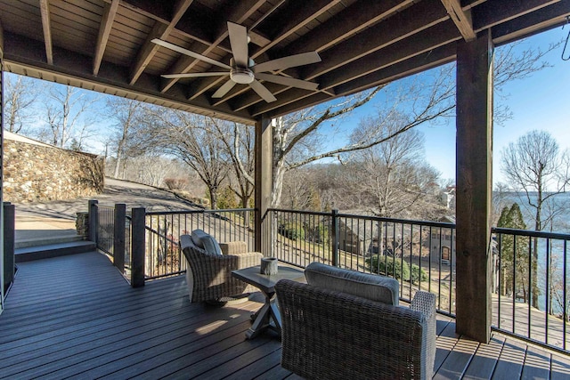 wooden deck featuring ceiling fan