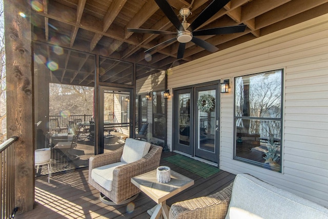 wooden terrace featuring french doors and ceiling fan