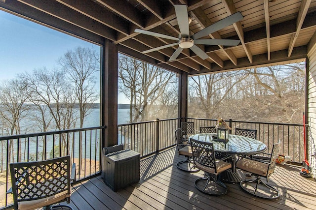 wooden deck featuring a water view and ceiling fan