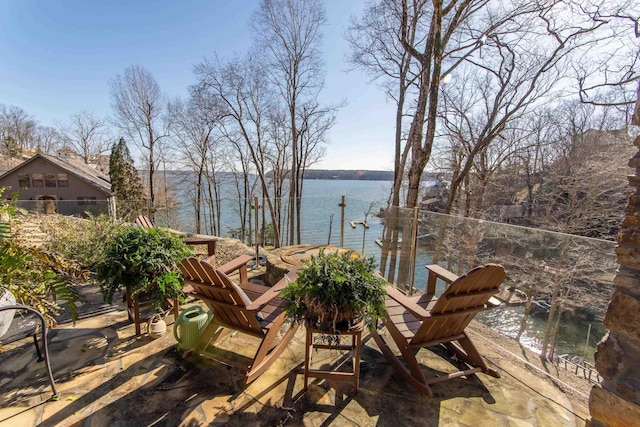 view of patio / terrace featuring a water view and a boat dock