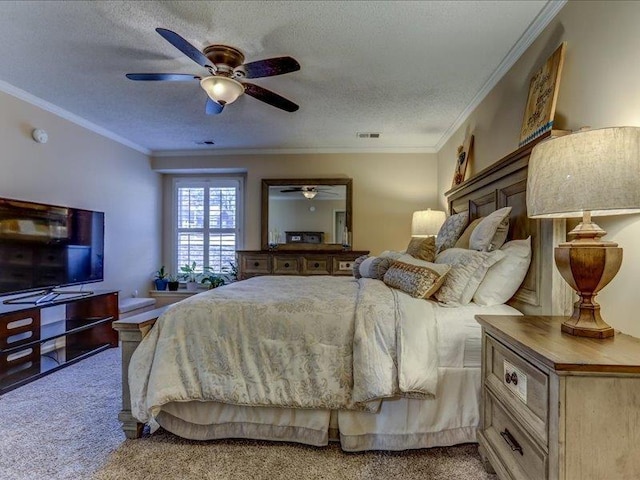 bedroom with crown molding, ceiling fan, carpet floors, and a textured ceiling