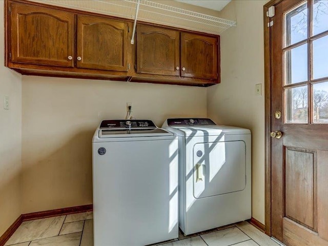 laundry room featuring cabinets and independent washer and dryer