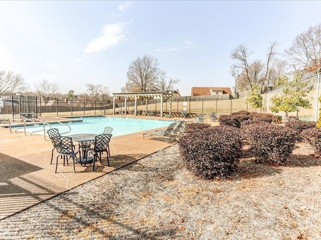 view of swimming pool with a pergola and a patio area