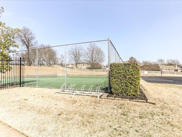 view of community with tennis court