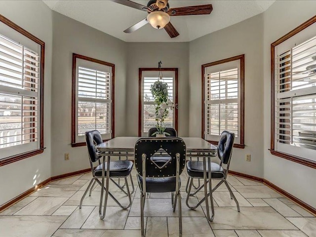 dining room featuring ceiling fan