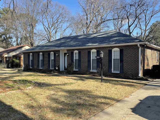 ranch-style house with a front lawn