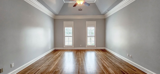 spare room with crown molding, ceiling fan, wood-type flooring, and vaulted ceiling