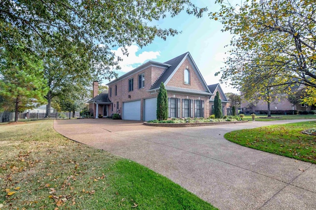 view of side of home with a garage and a yard