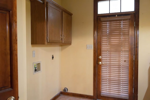 washroom with cabinets, washer hookup, and hookup for an electric dryer