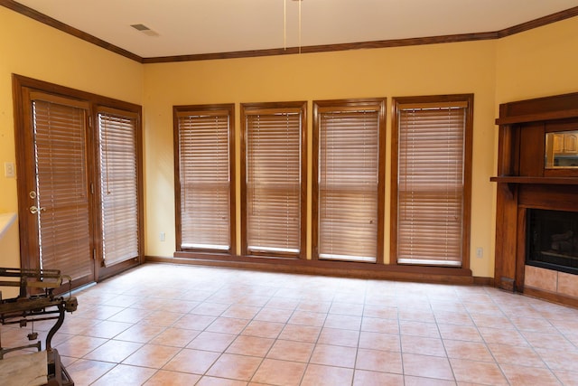 unfurnished living room with light tile patterned flooring and ornamental molding