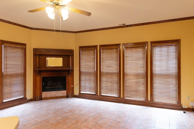 unfurnished living room with light tile patterned floors, crown molding, and ceiling fan