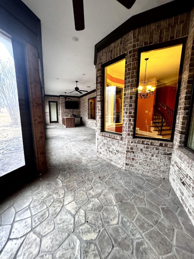 view of patio featuring ceiling fan