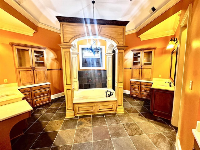 bathroom with ornamental molding, decorative columns, and vanity