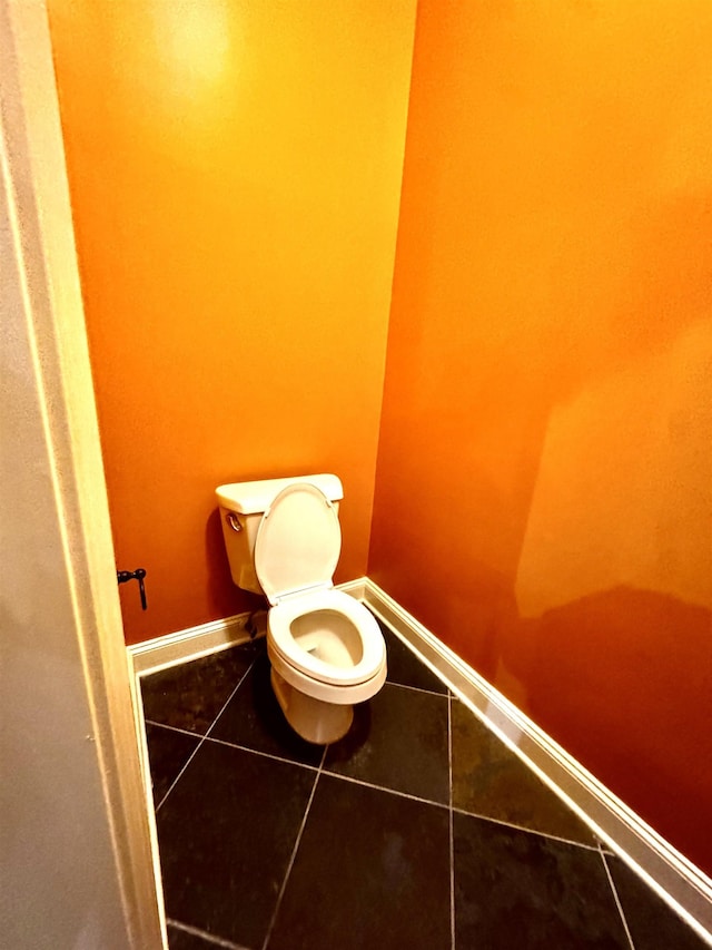 bathroom featuring tile patterned flooring and toilet