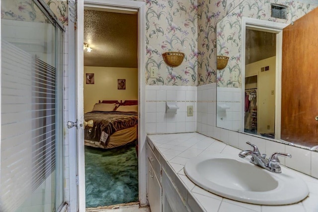 bathroom featuring vanity and a textured ceiling