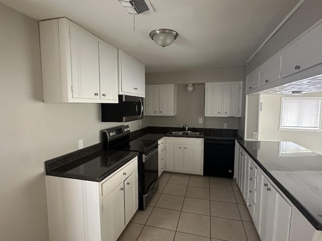 kitchen with white cabinetry, stainless steel appliances, and sink