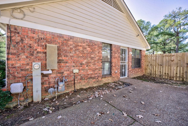 view of side of property featuring a patio