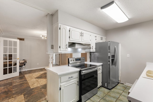 kitchen with appliances with stainless steel finishes, white cabinetry, sink, a textured ceiling, and wall chimney exhaust hood