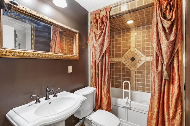 full bathroom with sink, toilet, and shower / bath combo with shower curtain