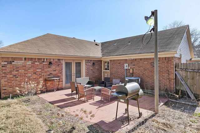 back of house with french doors and an outdoor living space