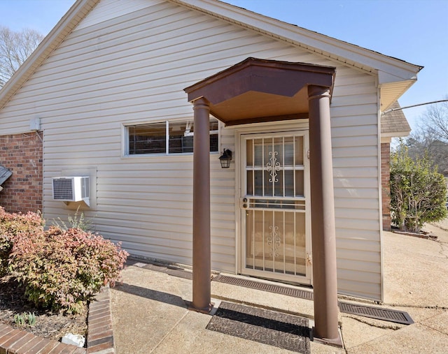 entrance to property featuring a wall mounted AC