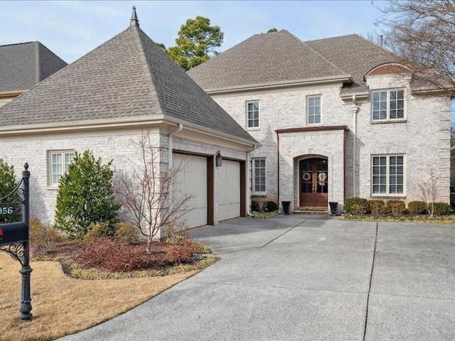 french country inspired facade featuring french doors