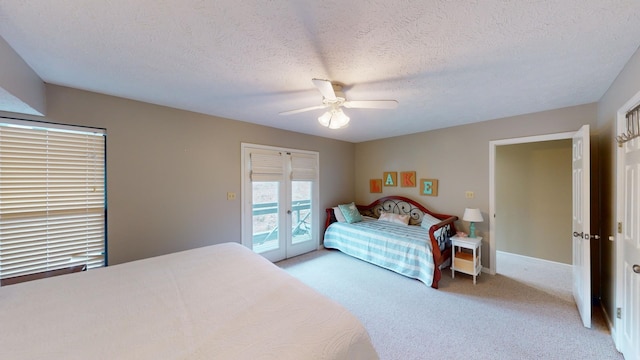 carpeted bedroom with ceiling fan, a textured ceiling, and access to outside