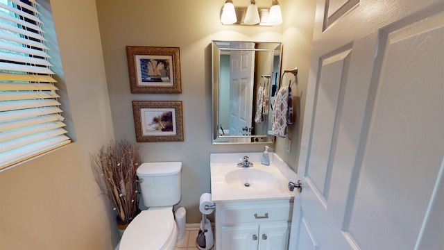 bathroom featuring vanity and toilet