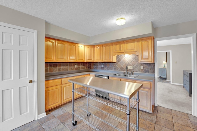 kitchen featuring sink, light brown cabinetry, and decorative backsplash