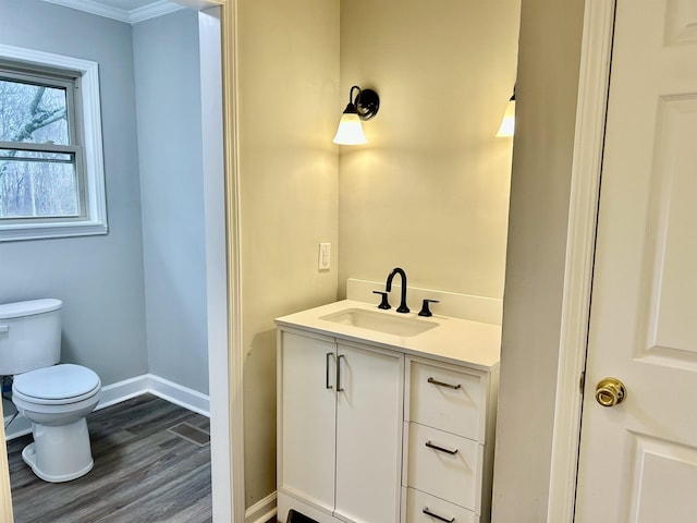 bathroom featuring hardwood / wood-style flooring, vanity, and toilet