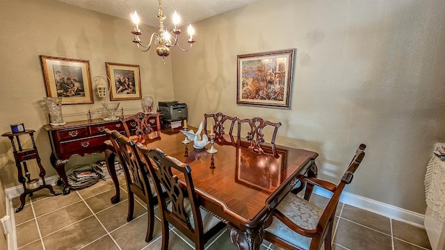 dining room with tile patterned flooring and a chandelier