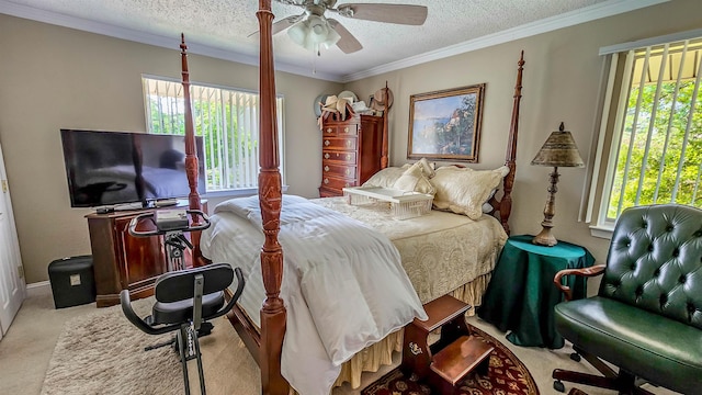 carpeted bedroom featuring ornamental molding, ceiling fan, and a textured ceiling