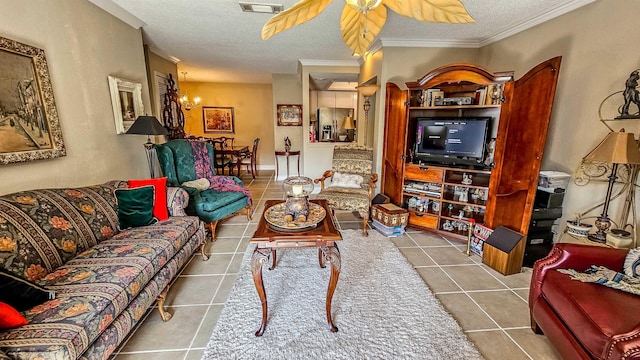 tiled living room with crown molding, ceiling fan with notable chandelier, and a textured ceiling