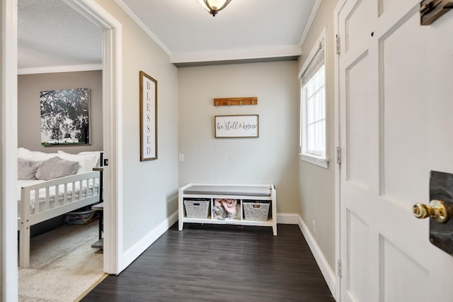 interior space featuring ornamental molding, a textured ceiling, and dark hardwood / wood-style flooring