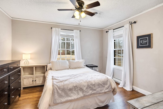 bedroom featuring ornamental molding, dark hardwood / wood-style floors, a textured ceiling, and a baseboard radiator