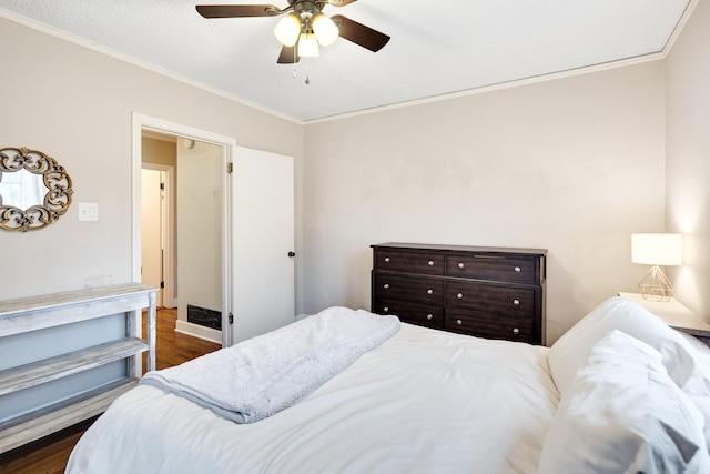 bedroom featuring ornamental molding, dark hardwood / wood-style floors, and ceiling fan