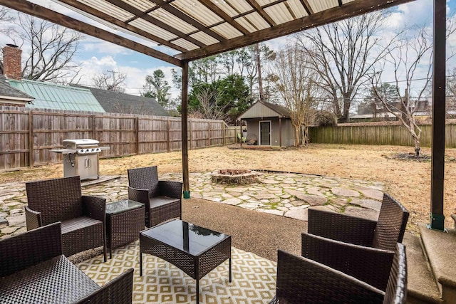 view of patio / terrace featuring an outdoor structure, area for grilling, and an outdoor hangout area