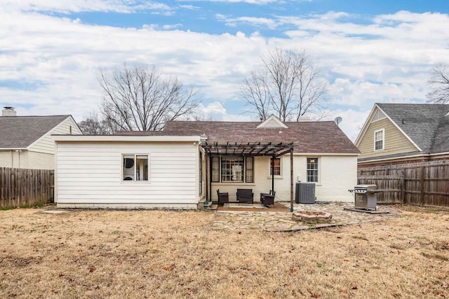 rear view of property with cooling unit, a yard, a pergola, and a patio area