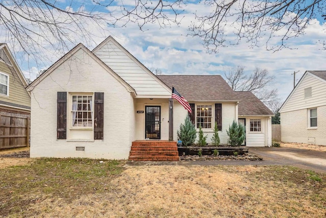 bungalow with a front lawn